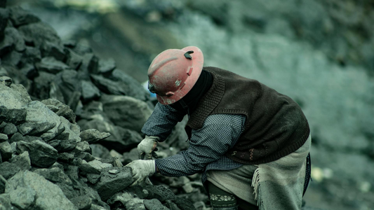 Coal miner gathering coal 