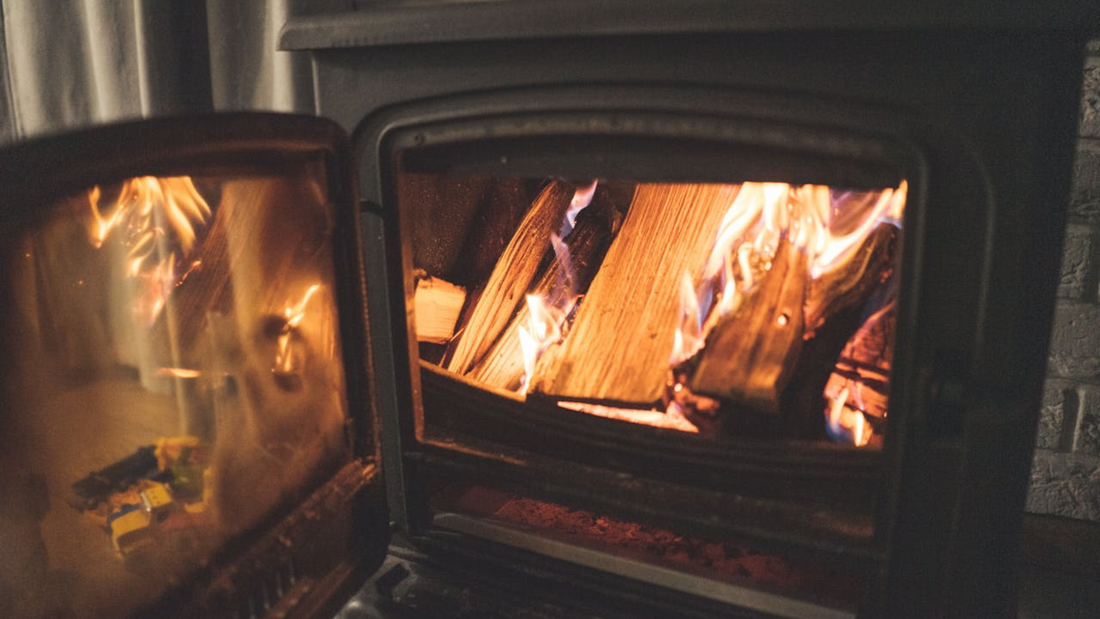 Open log burner, burning away in a cosy living room