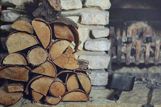 logs stacked up by the fireplace